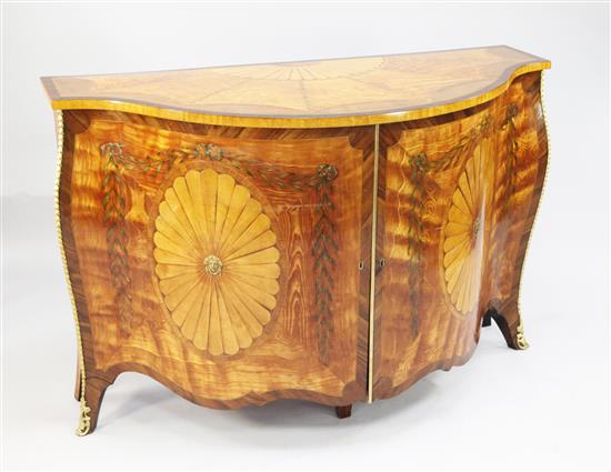 A George III style satinwood and marquetry serpentine commode, in the style of John Cobb, W.4ft 6.5in.